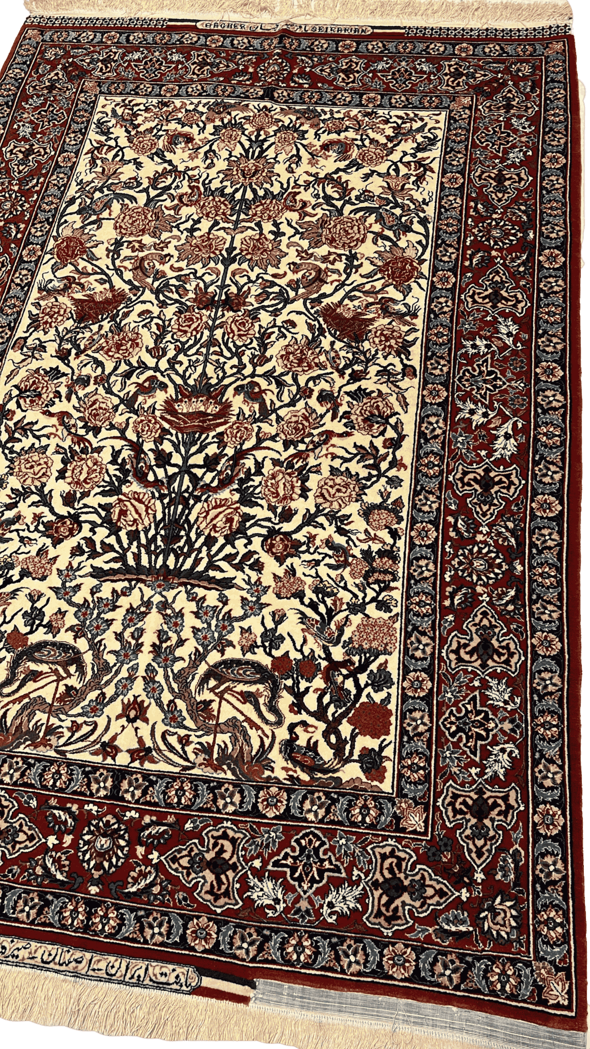 "Angled view of a hand-knotted Seirafian rug with a distinctive floral pattern and high knot density, crafted by Master Bagher Seirafian in Isfahan."
